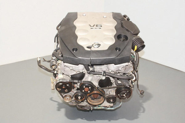 V6 engine on a gray surface with a white background